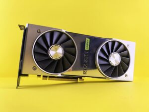 Close-up of a RTX 2080 Super graphics card against a bright yellow backdrop, showcasing high-tech design.